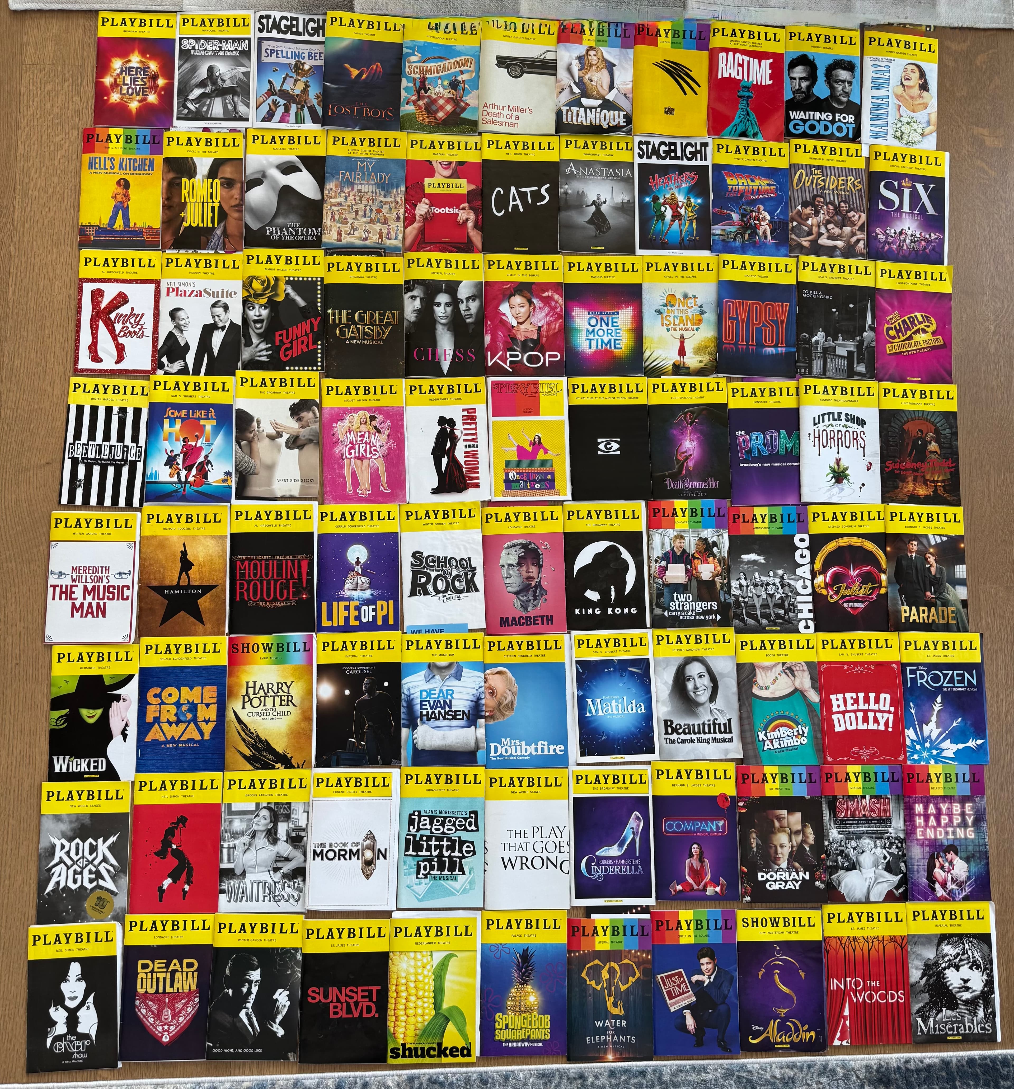 A grid of personal Playbills laid out on the floor